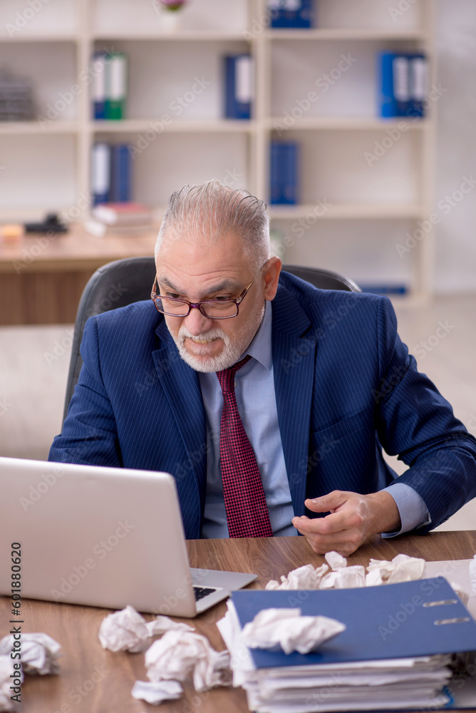 Old male employee in brainstorming concept Old male employee in brainstorming concept