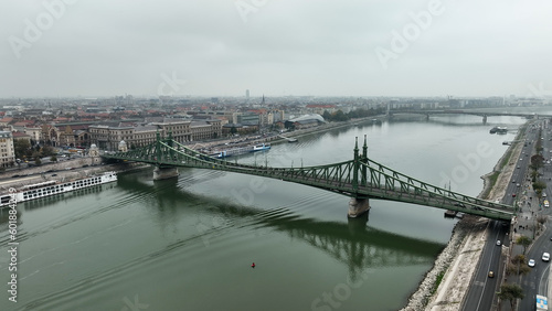 Aerial view of Budapest Szabadsag hid (Liberty Bridge or Freedom Bridge), connects Buda and Pest across the River Danube. A tram circulates