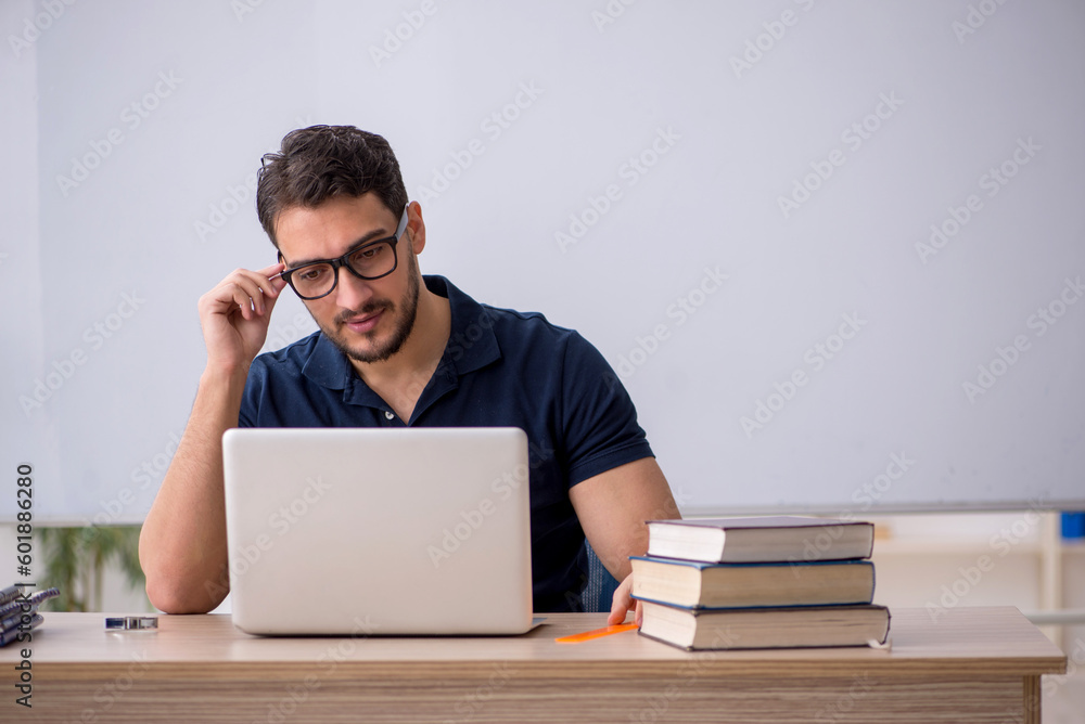 Young male teacher in telestudying concept Young male teacher in telestudying concept