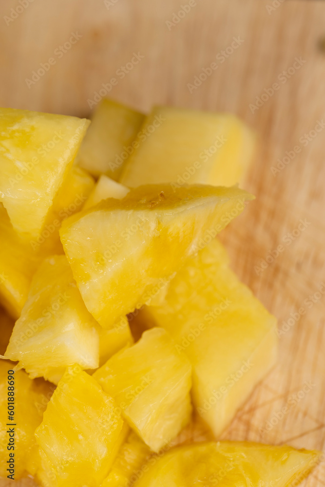 Sliced into pieces of fresh ripe peeled pineapple Sliced into pieces of fresh ripe peeled pineapple