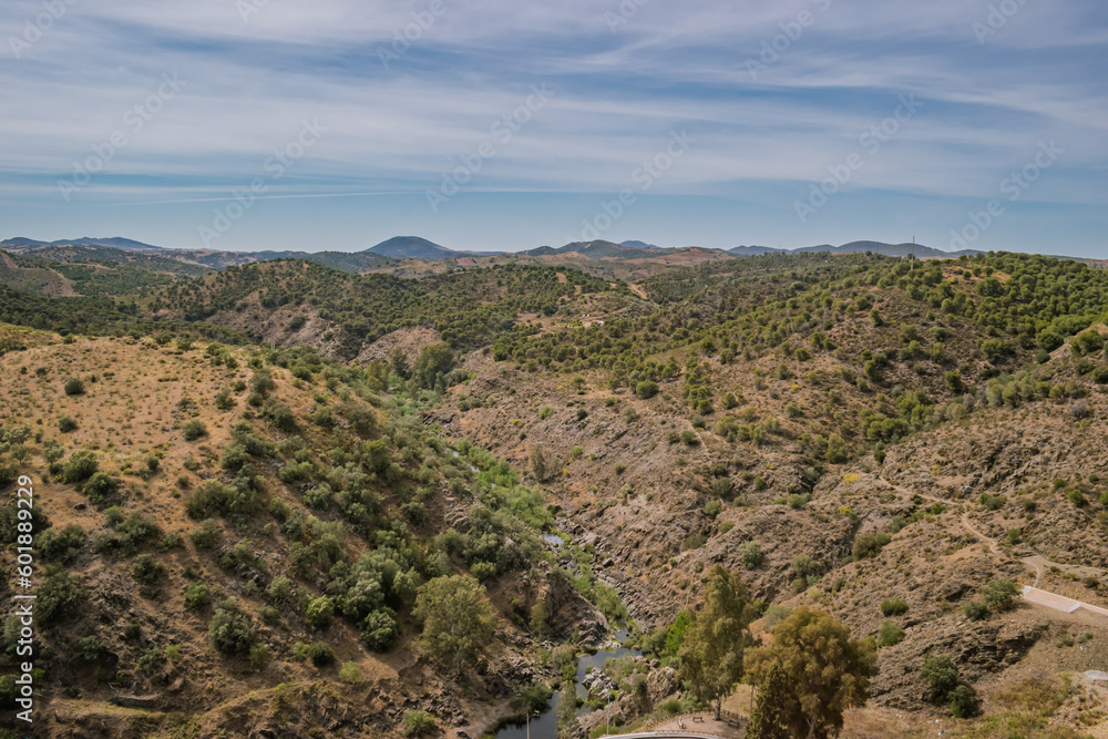 Valley with vegetation in aerial view and Oeiras river and gradient mountains in the horizon, Mértola PORTUGAL
