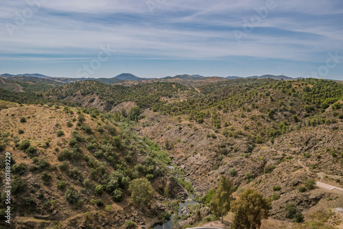 Valley with vegetation in aerial view and Oeiras river and gradient mountains in the horizon, Mértola PORTUGAL 