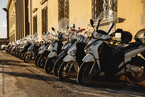 Fototapeta Naklejka Na Ścianę i Meble -  Classic scooters on the narrow streets of Italian city.