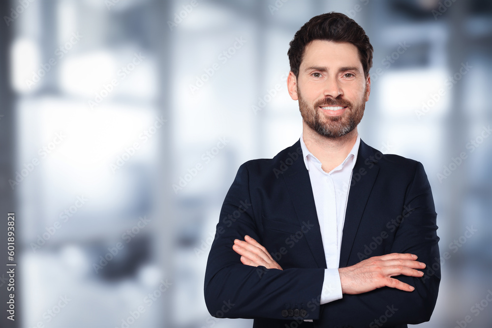 Handsome real estate agent in office, space for text