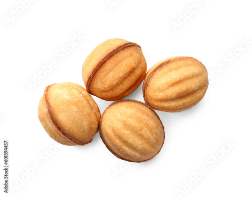 Delicious nut shaped cookies with condensed milk on white background, top view