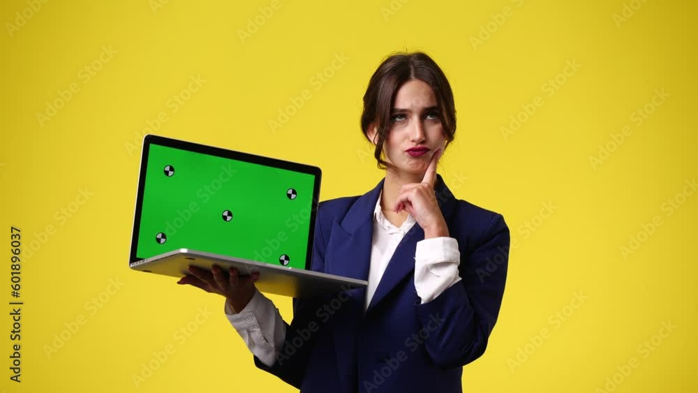 4k video of one girl using chroma key laptop and thinking over yellow background. 4k video of one girl using chroma key laptop and thinking over yellow background.