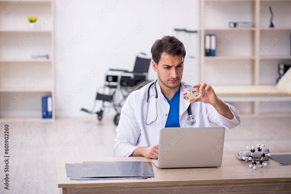 Young male doctor working in the clinic Young male doctor working in the clinic