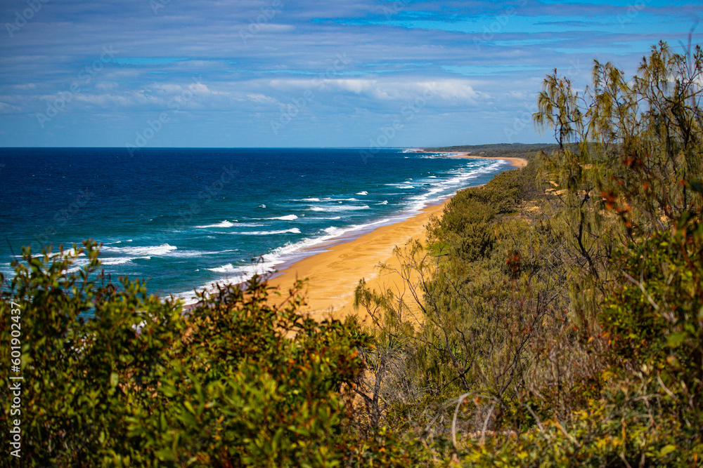 panorama of beautiful long beach with orange sand in deepwater national park south from agnes water and seventeen seventy; unique coast of gladstone region in queensland, australia;