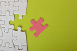 The jigsaw puzzle with a missing piece is a metaphor for the challenges we face in business. We may encounter missing pieces, but we must be resourceful and persistent to complete the puzzle 