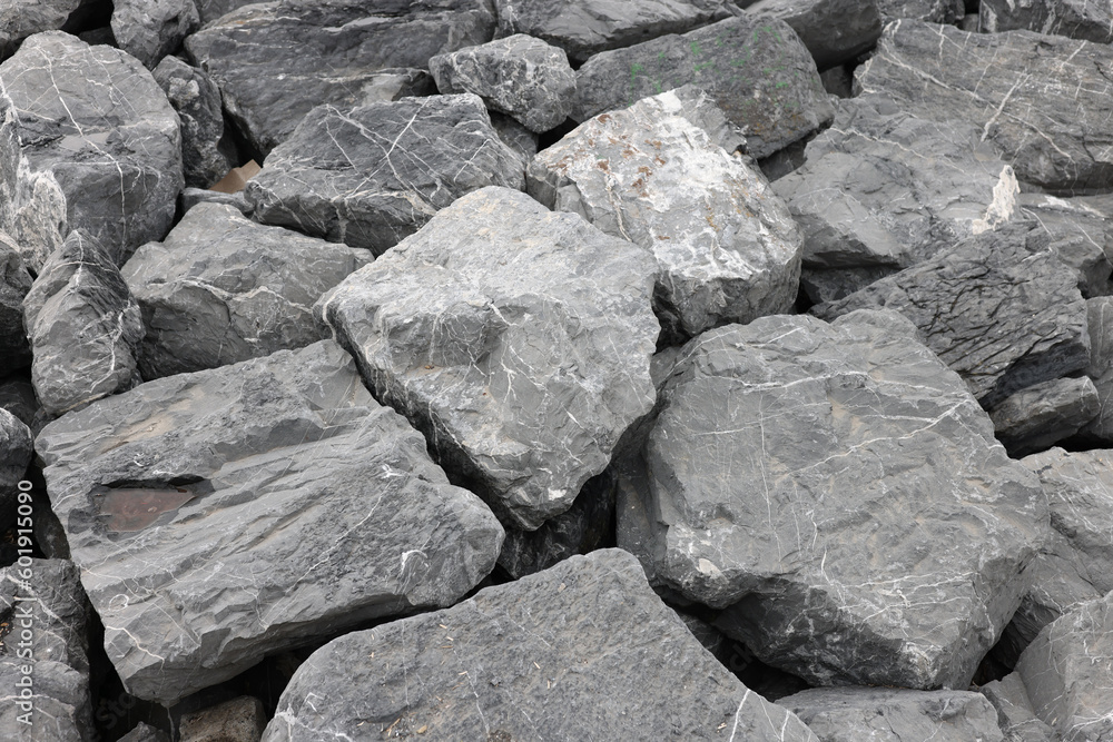 Coastal reinforcement with large granite rocks at seashore Coastal reinforcement with large granite rocks at seashore