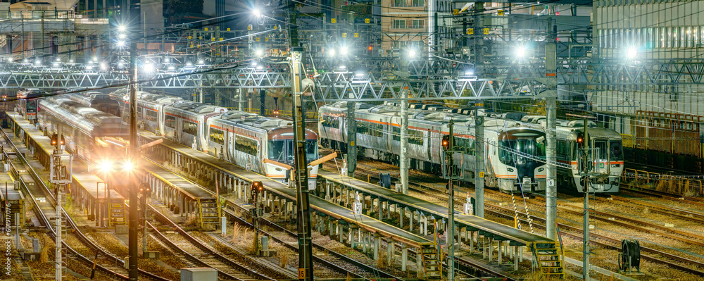 Train depot at Nagoya station at night.