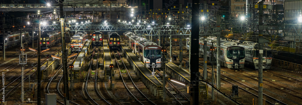 Train depot at Nagoya station at night.