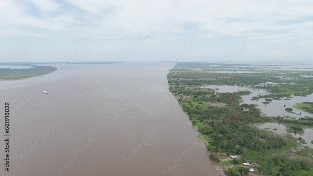 Drone shot overlooking the Amazon river and wetlands, cloudy day in Obidos, Brazil Drone shot overlooking the Amazon river and wetlands, cloudy day in Obidos, Brazil
