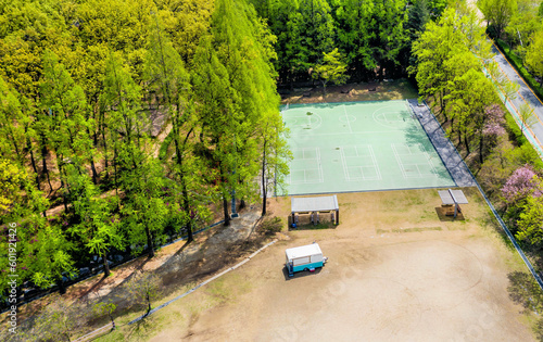Aerial view of basketball court and covered benches in rural park. photo