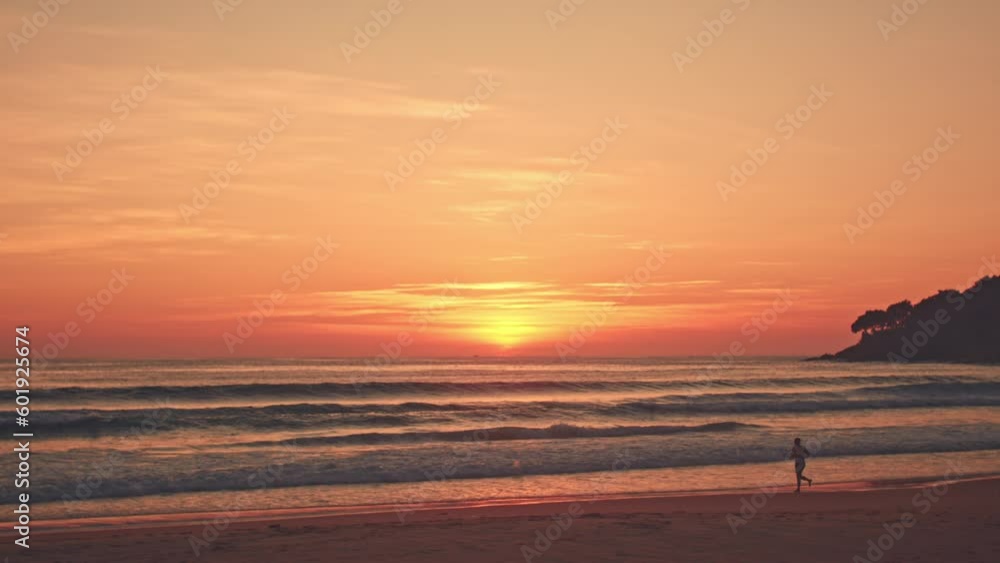 bright red sky in sunset. abstract nature background..Sunset with sweet yellow color light rays and other atmospheric effects..big wave step forward to the beach at Karon beach Phuket Thailand. bright red sky in sunset. abstract nature background..Sunset with sweet yellow color light rays and other atmospheric effects..big wave step forward to the beach at Karon beach Phuket Thailand.