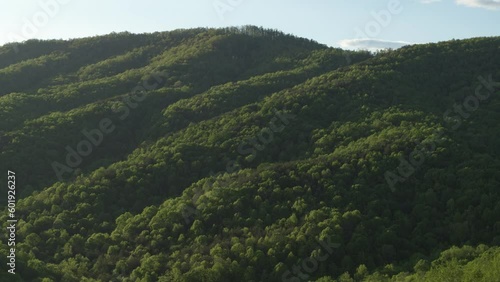 Aerial of forested hillsides in North Carolina at sunset near Asheville in Spring photo