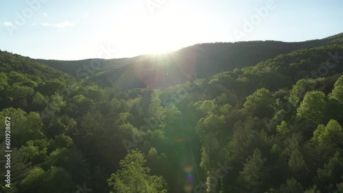 Aerial push in on sunset in Appalachian mountains in North Carolina near Asheville in spring time