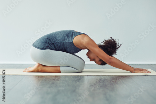 Canvas Print Yoga, child pose and woman stretching on mat for wellness, workout and fitness in gym studio