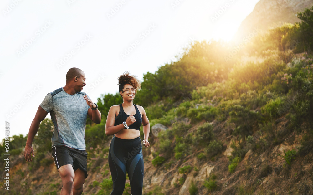 Fitness, nature and couple walking by a mountain training for a race, marathon or competition. Sports, exercise and African athletes or runners doing outdoor running cardio workout together at sunset