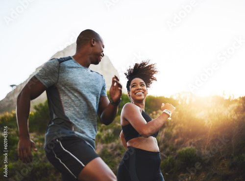 Fototapeta Naklejka Na Ścianę i Meble -  Fitness, energy and athletes running in nature by a mountain training for race, marathon or competition. Sports, health and African couple doing outdoor cardio workout or exercise together at sunset.