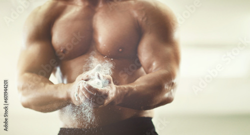 Hands  fitness and powder dust in gym for grip  workout and exercise for wellness. Sports  health and man  bodybuilder or male athlete clapping with chalk and ready to start training for muscles.