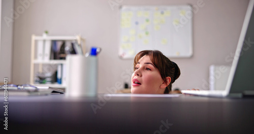 Scared Woman Hiding Behind Chair