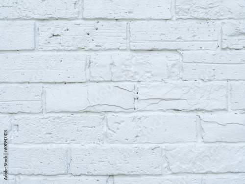 Close up. Brick wall and white surface, clean, rough, uneven surface material. Retro decoration construction