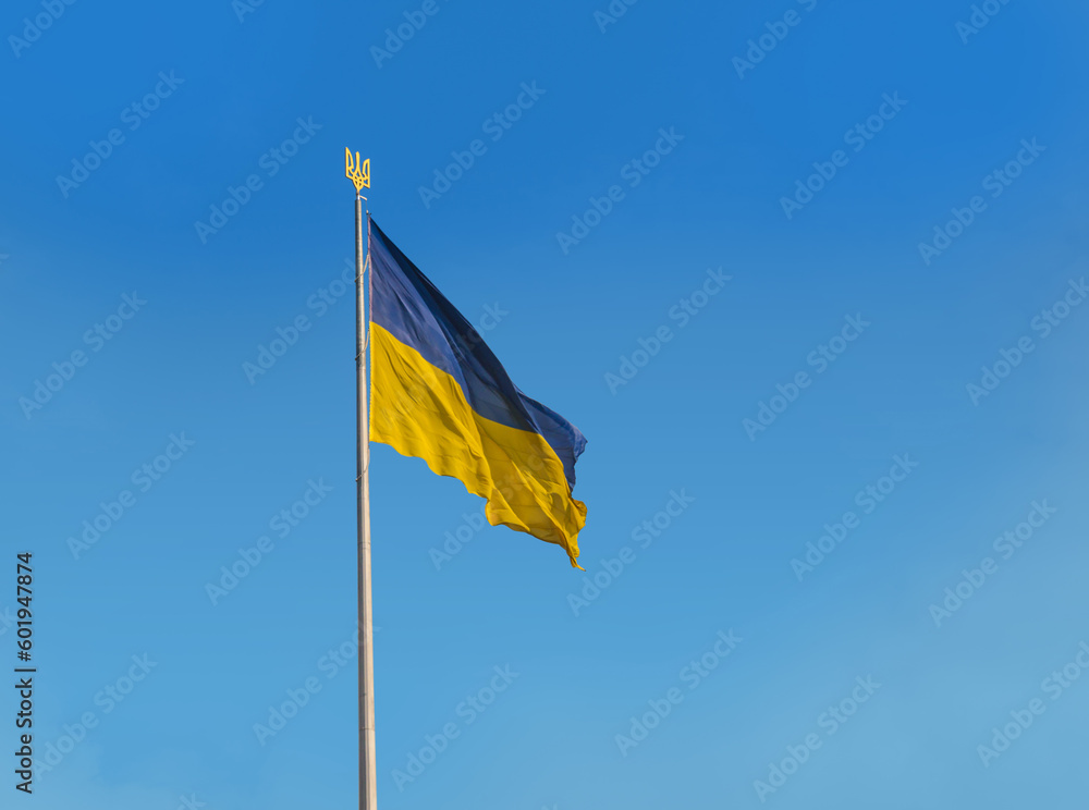 Flag of Ukraine with a trident in the blue sky Flag of Ukraine with a trident in the blue sky