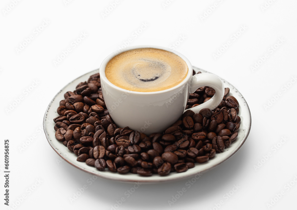 Espresso coffee in small cup and fresh raw beans on saucer on white background Espresso coffee in small cup and fresh raw beans on saucer on white background