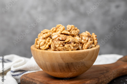 Walnut. Walnut kernel in wooden bowl. Superfood. Vegetarian food concept. Healthy snacks