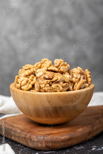 Walnut. Walnut kernel in wooden bowl. Superfood. Vegetarian food concept. Healthy snacks. Close up