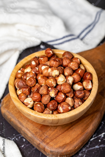 Hazelnut. Peeled hazelnuts in wooden bowl. Superfood. Vegetarian food concept. Healthy snacks. Close up