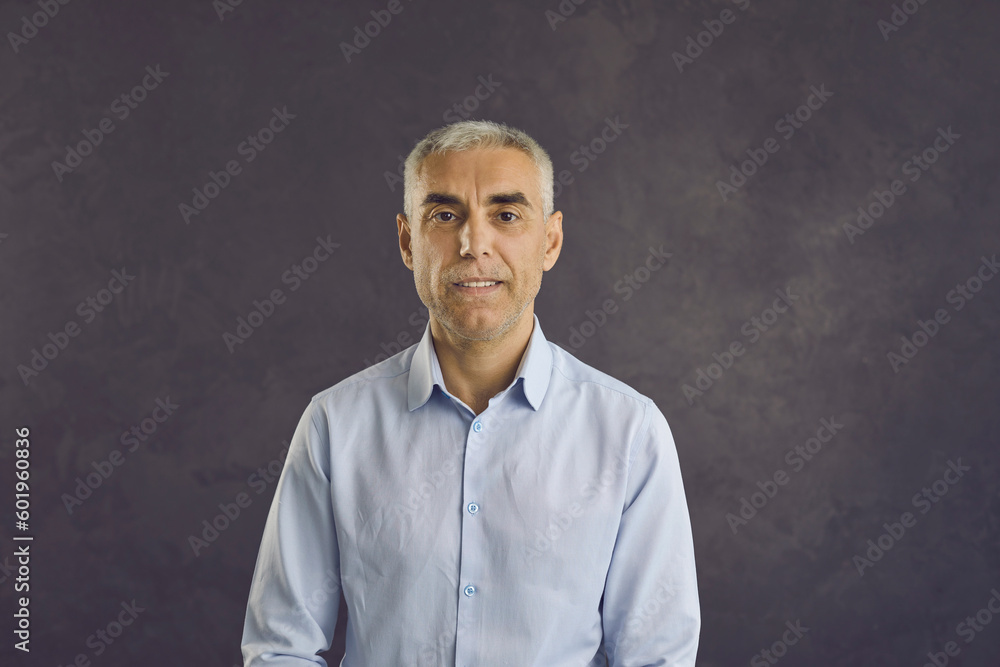 Headshot portrait of serious middle-aged Caucasian man isolated on black studio background. Profile picture of smiling confident successful mature male boss or businessman. Diversity, employment. Headshot portrait of serious middle-aged Caucasian man isolated on black studio background. Profile picture of smiling confident successful mature male boss or businessman. Diversity, employment.