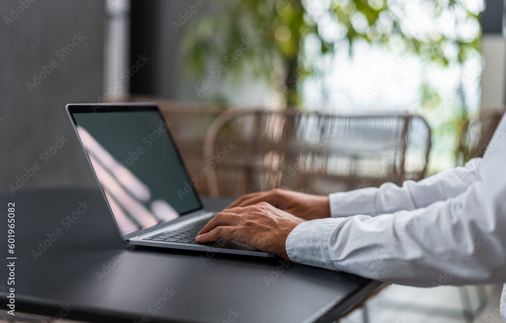Man in white shirt using laptop Man in white shirt using laptop