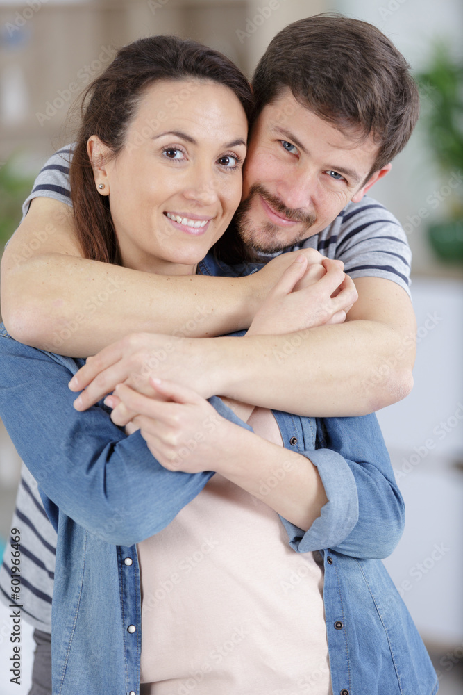 Fototapeta premium a happy couple hugging indoors