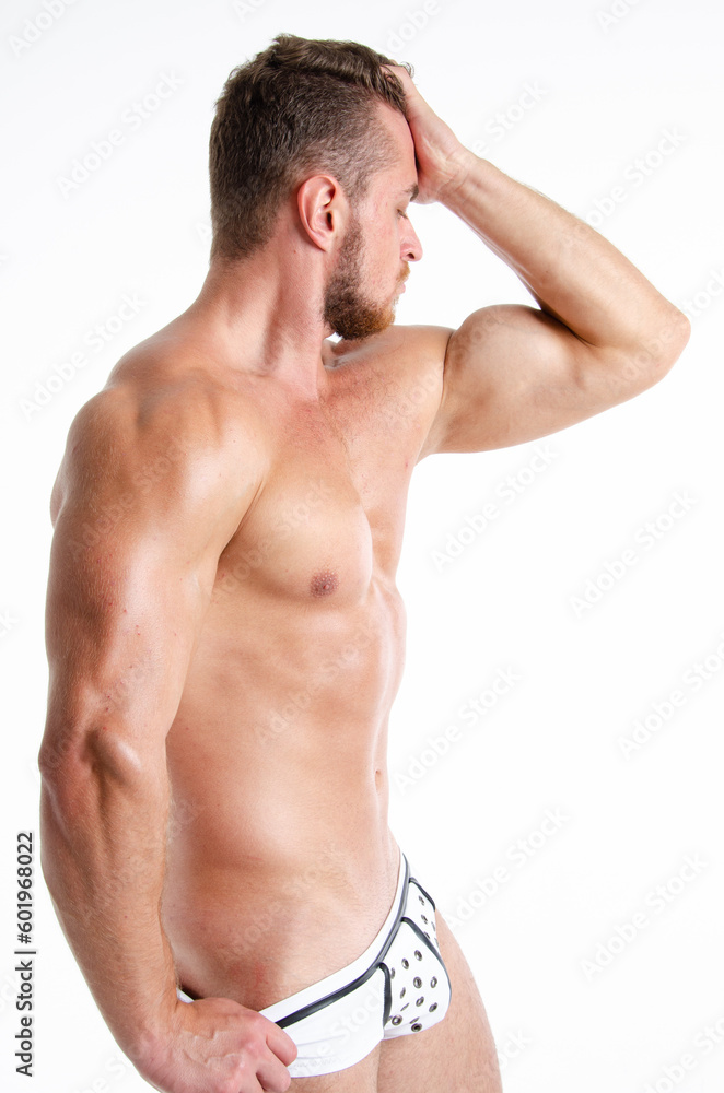 Young handsome stripper posing in the studio. A man with an athletic body dressed as a police officer. Young handsome stripper posing in the studio. A man with an athletic body dressed as a police officer.