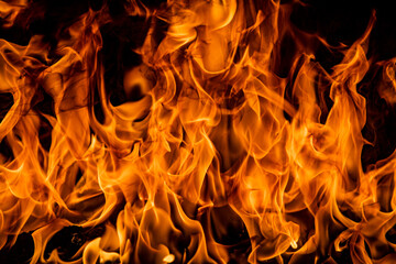 Fire blaze flames on black background. Fire burn flame isolated, abstract texture. Flaming explosion effect with burning fire.