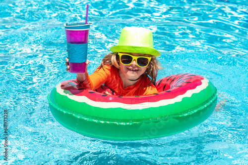 Child in swimming pool. Summer activity. Healthy kids lifestyle. Child water toys. Children play in tropical resort.