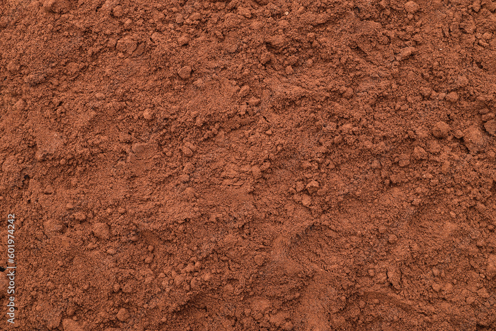 Heap of freshly ground coffee on the table. Close-up. Top view.