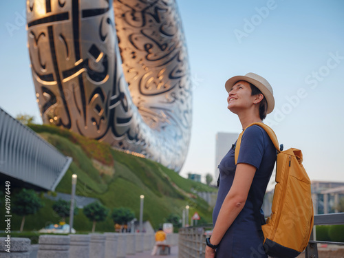 Photography 20 March 2023, Dubai, UAE: happy Tourist against background of the Future Museum