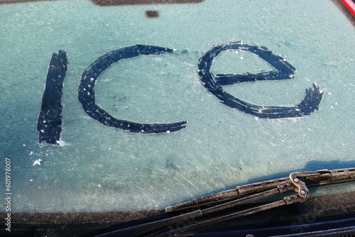 Tableau sur toile The word ice spelt on the Icey windscreen of a cold car in the Winter