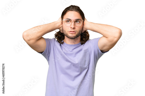 Young handsome man over isolated background frustrated and covering ears © luismolinero