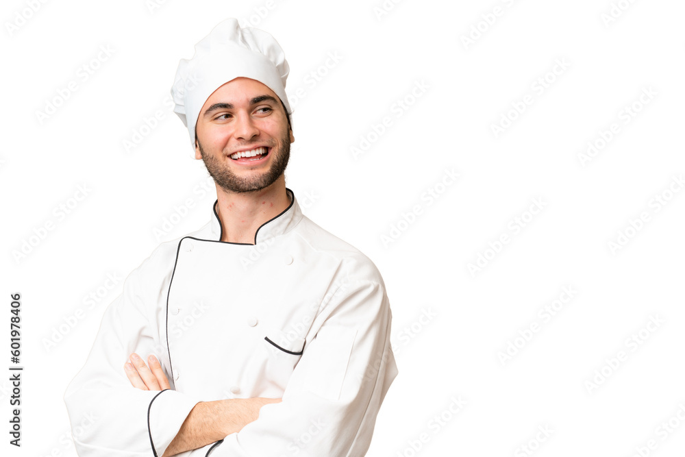 Young handsome chef man over isolated background with arms crossed and happy Young handsome chef man over isolated background with arms crossed and happy