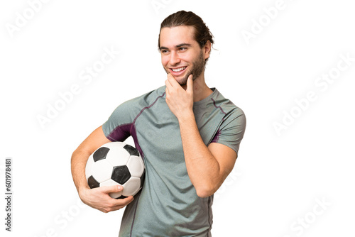 Young handsome football player man over isolated background looking to the side and smiling
