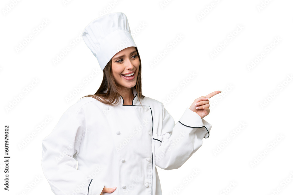 Young chef caucasian woman over isolated background pointing finger to the side and presenting a product Young chef caucasian woman over isolated background pointing finger to the side and presenting a product
