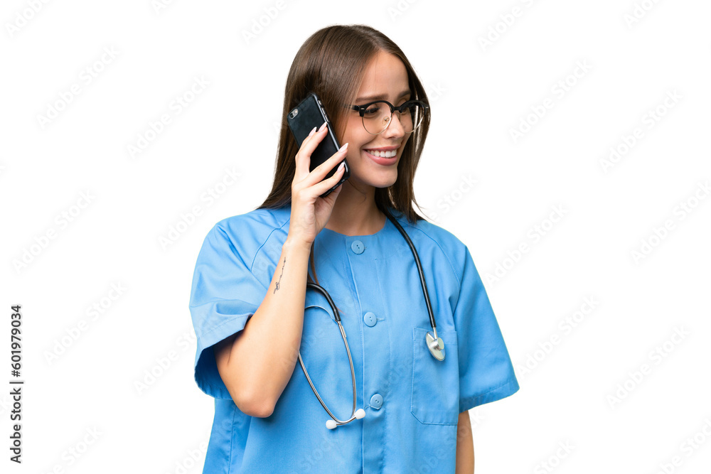 Young nurse caucasian woman over isolated background keeping a conversation with the mobile phone with someone Young nurse caucasian woman over isolated background keeping a conversation with the mobile phone with someone