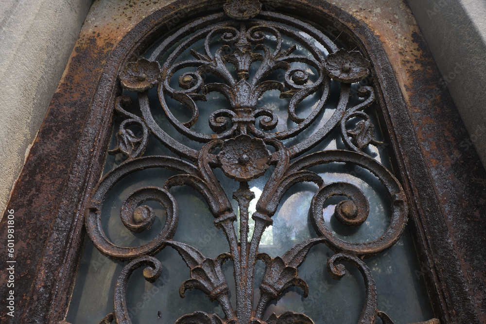 Rust deteriorations. Really old and decrepit door from a century-old cemetery (Père Lachaise, France) Rust deteriorations. Really old and decrepit door from a century-old cemetery (Père Lachaise, France)
