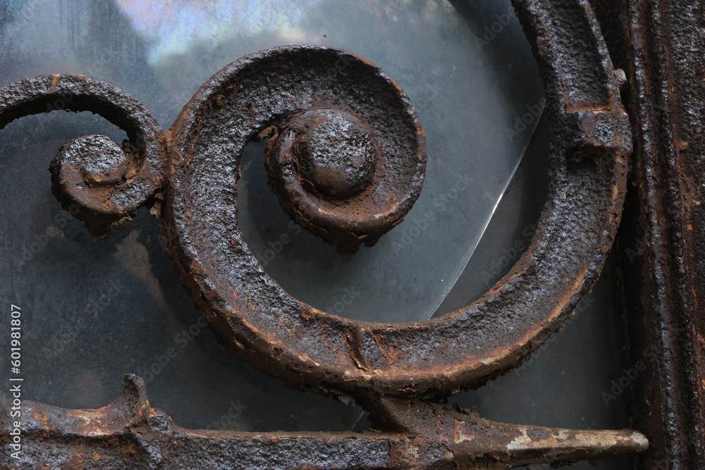 Rust deteriorations. Really old and decrepit door from a century-old cemetery (Père Lachaise, France) Rust deteriorations. Really old and decrepit door from a century-old cemetery (Père Lachaise, France)