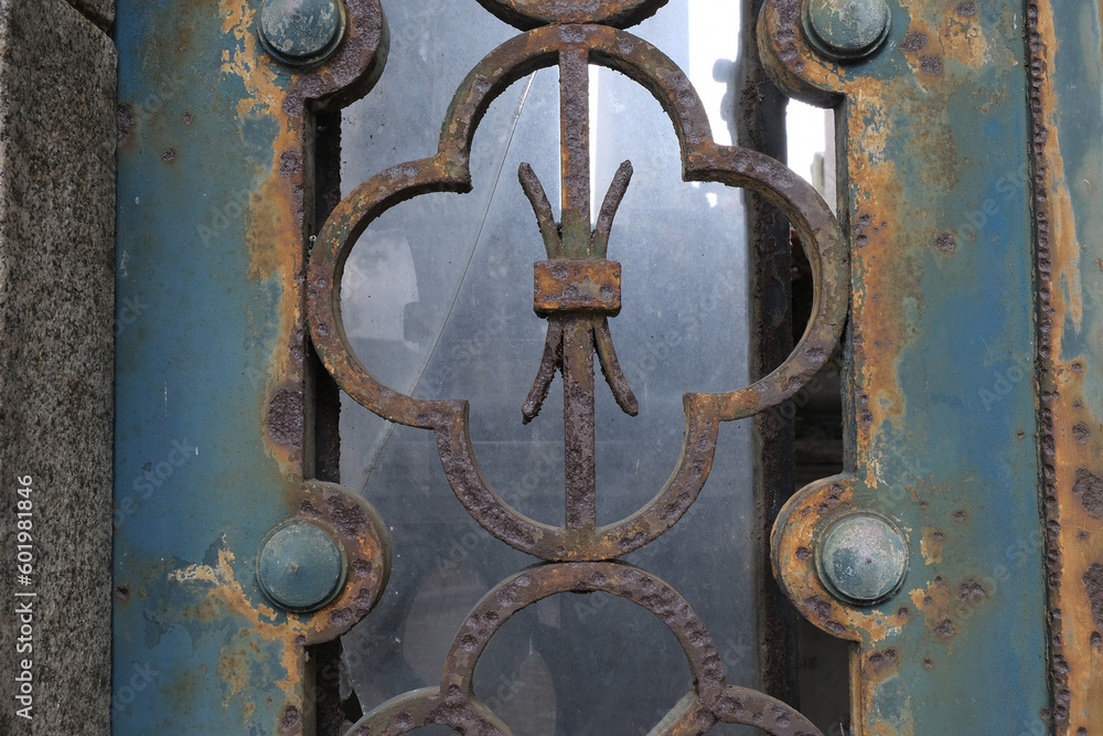 Rust deteriorations. Really old and decrepit door from a century-old cemetery (Père Lachaise, France) Rust deteriorations. Really old and decrepit door from a century-old cemetery (Père Lachaise, France)