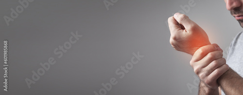 Fotografie Caucasian man suffering from wrist pain.